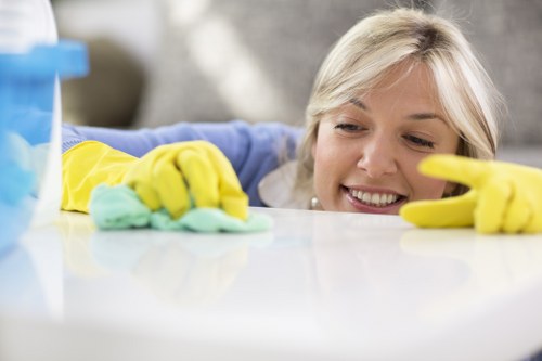 Technician operating extraction machine during carpet cleaning